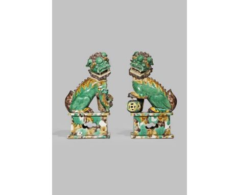 A LARGE AND IMPOSING PAIR OF CHINESE FAMILLE VERTE BUDDHIST LION DOGS KANGXI 1662-1722 Powerfully modelled with their heads t