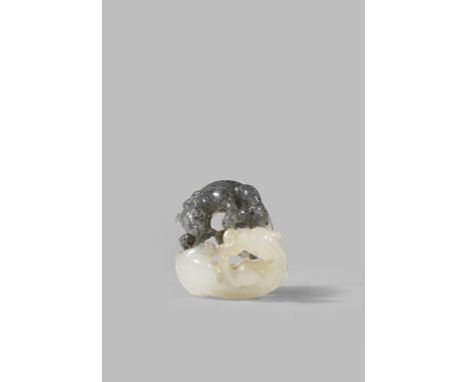 A CHINESE CELADON AND GREY JADE CARVING OF TWO CHILONG QING DYNASTY OR LATER Fighting over a spray of lingzhi fungus, one pic
