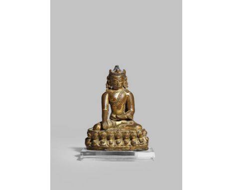 A SMALL TIBETO-CHINESE GILT BRONZE FIGURE OF BUDDHA 14/15TH CENTURY Sitting in dhyanasana touching the earth and raised on a 