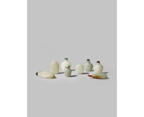 SEVEN CHINESE JADE SNUFF BOTTLES  QING DYNASTY  One carved as a finger citron, another with a ribbed body, one a pebble jade 