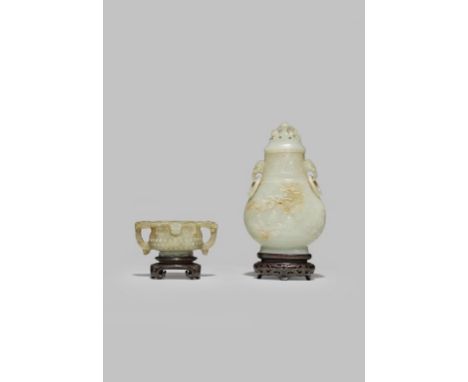 A CHINESE PALE CELADON JADE VASE AND COVER QING DYNASTY The flattened pear-shaped body carved in shallow relief to each side 