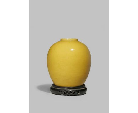 A CHINESE YELLOW GLAZED OVOID VASE LATE QING DYNASTY With a plain body, the base incised with a six character Kangxi mark, to