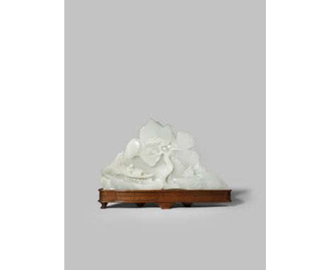 A CHINESE PALE CELADON JADE MOUNTAIN GROUP LATE QING DYNASTY Depicting a figure in a sampan, another on the river bank and a 