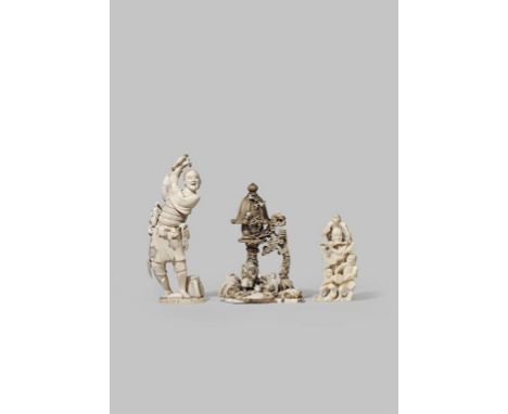 λ THREE JAPANESE IVORY OKIMONO MEIJI 1868-1912 The first depicting two dressed up monkeys under a monumental bone lantern, si