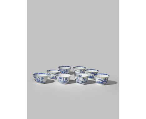 EIGHT CHINESE  BLUE AND WHITE TEA BOWLS KANGXI 1662-1722 The bodies moulded with double tiers of petals and painted in underg