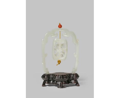 A CHINESE PALE CELADON JADE PENDANT AND STAND QING DYNASTY OR LATER Carved to represent a flattened stool, the central pillar