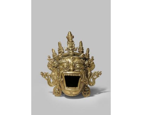 A TIBETAN BRONZE INCENSE BURNER 19TH/20TH CENTURY Cast as a fierce demon's head with his jaws wide open and baring his teeth,