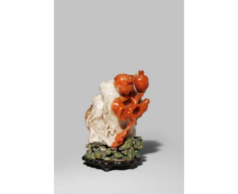 λ A LARGE CHINESE IMPERIAL CARNELIAN-AGATE 'POMEGRANATE' DOUBLE VASE AND STAND QIANLONG 1736-95 Boldly carved with a fruiting