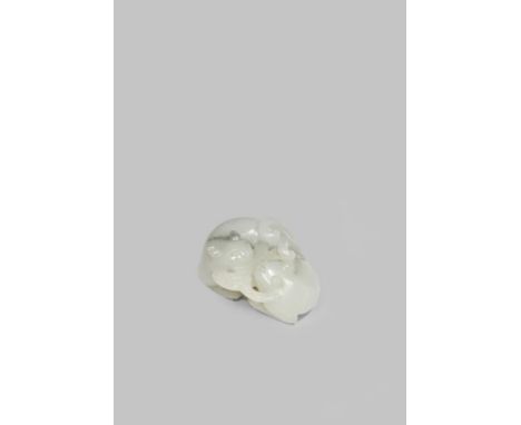 A CHINESE PALE CELADON JADE GROUP OF TWO CATS QING DYNASTY Holding a dragonfly in their mouths, 5.2cm. Cf. The Complete Colle