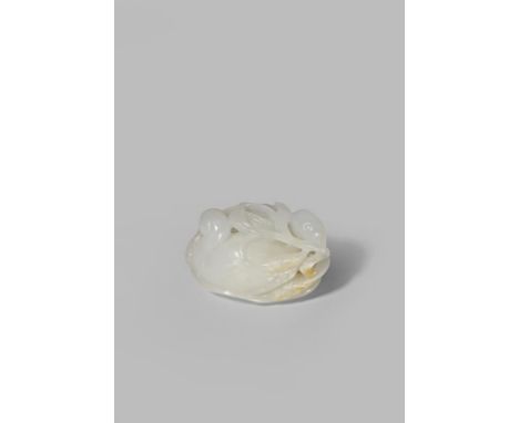A CHINESE WHITE JADE CARVING OF QUAILS QING DYNASTY OR LATER Carved as two birds huddled together on a large lotus leaf with 