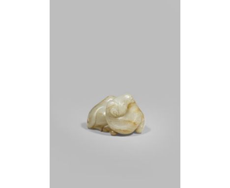 A CHINESE PALE CELADON JADE MODEL OF A BACTRIAN CAMEL QING DYNASTY OR LATER Reclining with his legs tucked underneath the bod