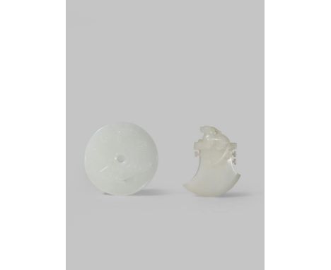 TWO WHITE JADE CARVINGS QING DYNASTY OR LATER One carved in the shape of an axe head with a qilin seated on the top, the othe