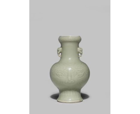 A SMALL CHINESE LONGQUAN CELADON ARCHAISTIC VASE KANGXI 1662-1722 The body moulded in shallow relief with taotie masks beneat