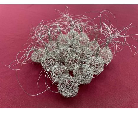 Contemporary wire work sculpture formed as sixteen plant bulbs, 22cm sqaure