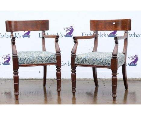Pair of William IV mahogany carver dining chairs, with broad top rails and overstuffed seats on ring turned tapering legs (2)