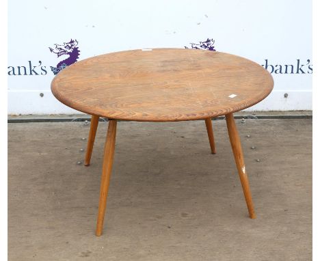 Ercol style coffee table, the circular elm top on turned beech legs, 43 cm high, 74 cm diameter