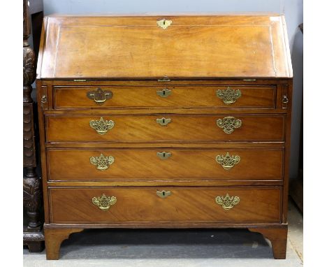 George III mahogany bureau, the sloping fall enclosing a fitted interior over four long graduated drawers on bracket feet. H1