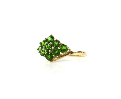 Green diopside ring, nine round cut green diopside stones set in a diamond shape, mounted in 9 ct yellow gold, ring size SCon