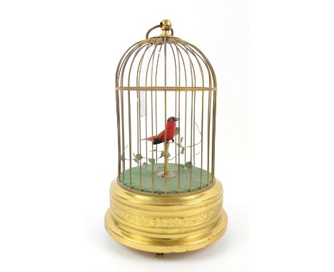 German singing bird automaton in brass cage H26cmCondition Report:  Late 20th century (labelled West Germany). Spots of tarni