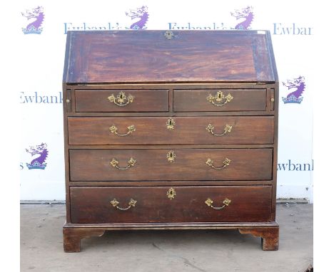 George III mahogany bureau, the sloping fall front enclosing pigeon holes and drawers over two short and three long graduated