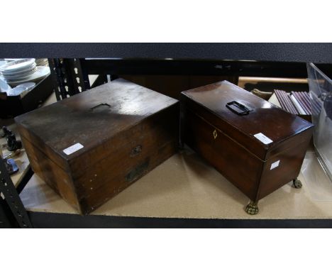 19th century crossbanded mahogany tea caddy, with swing handle, two lidded compartments and aperture for bowl, on brass lion 