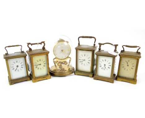 Five French brass carriage timepieces and an anniversary clock