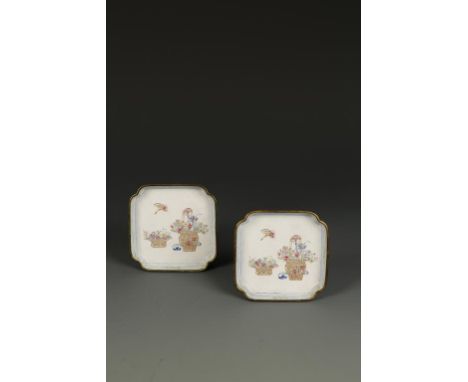 A PAIR OF CHINESE CANTON ENAMEL SQUARE DISHES with canted corners, decorated with butterflies above baskets of flowers, the b