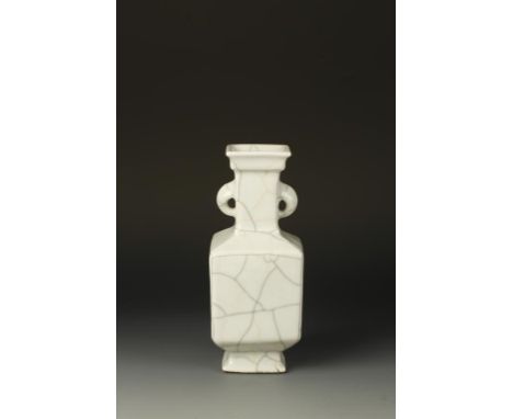 A CHINESE GEYAO SQUARE VASE, the stepped top above a long neck with mask handles, the broad lower body above a spreading foot