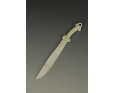 A CHINESE PALE CELADON JADE CEREMONIAL DAGGER, the handle with a ruyi-scroll terminal, the hand guard with archaic scrolls be