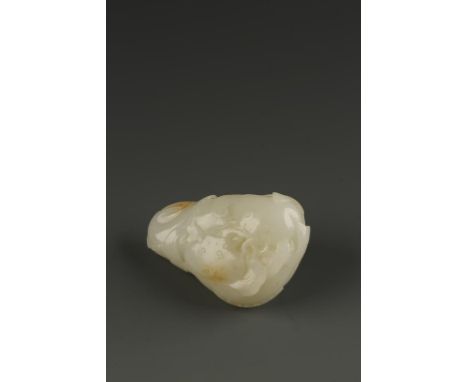 A CHINESE WHITE AND RUSSET JADE CARVING OF TWO CAT FISH, the creatures facing each other and surrounded by lingzhi, Qing Dyna