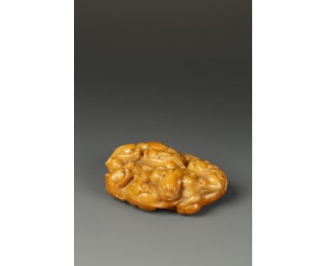 A RARE CHINESE SOAPSTONE 'CHILONG' BOULDER, the warm stone of amber-yellow tone, carved with five writhing chilong dragons, l