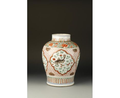 A CHINESE WUCAI BALUSTER JAR, the central body decorated with four ogee panels with fish on a diaper ground beneath a band of