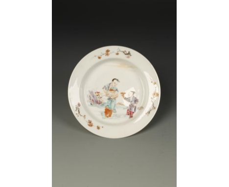 A CHINESE FAMILLE ROSE SAUCER DISH, the wide everted rim above the rounded tapering body and short foot, the fine porcelain t