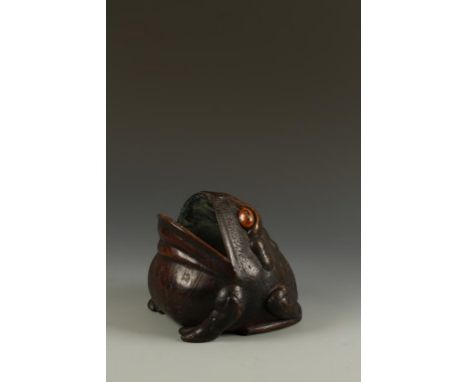 A RARE JAPANESE WOOD TOAD-FORM HAND WARMER the creature with its head raised and metal-lined mouth open, the chest area with 