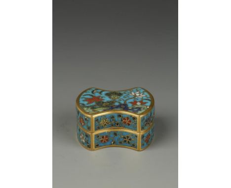 A CHINESE CLOISONNÉ INGOT-FORM MINIATURE BOX, the cover decorated with flowers in a garden landscape on a light blue ground, 