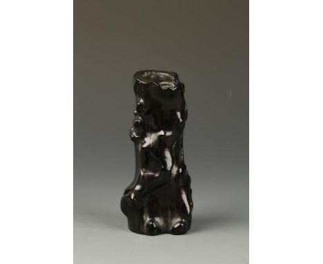 A SMALL CHINESE BLACKWOOD BRUSH POT, of naturalistic slender trunk form, the dense wood with a rich patina, Qing Dynasty, 18t