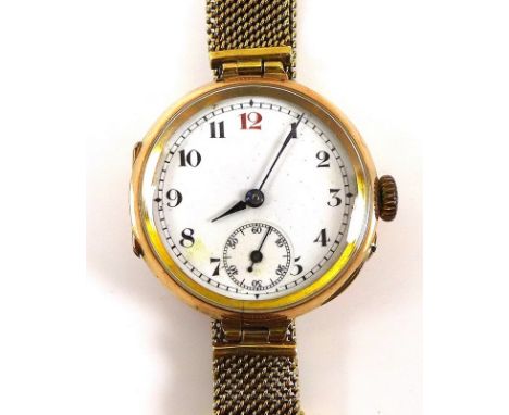 A vintage 9ct gold cased wristwatch with white enamel dial with subsidiary seconds dial, blued hands, black Arabic numerals w