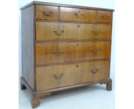 A George III style chest of drawers, mahogany veneered over pine core, crossbanded and inlaid, three short over three long dr