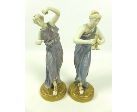 A pair of Royal Worcester porcelain figurines, circa 1928, modelled as music and dance, with a Grecian maiden playing a pipe 