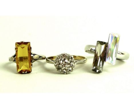 A collection of three dress rings, comprising a Julien MacDonald designer ring of modern design, size P, a silver and citrine
