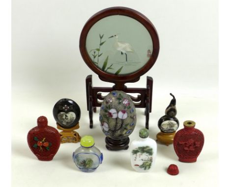 A group of Chinese scent bottles, mid to late 20th century, one glass reverse painted, 5.5cm, two red lacquer, 7.5cm, one cer