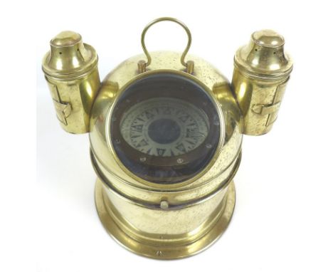 A brass ship's binnacle containing gimballed compass, the dial marked Bergen, Nautik, Norway, the housing with two attached o
