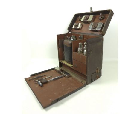 An early to mid 20th doctor's travelling case by C.J. Hewlett and Sons Ltd of London, containing various tools and medicinal 