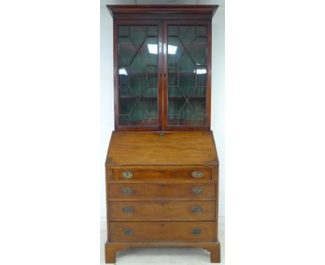 A George III mahogany bureau bookcase, twin astragal glazed doors enclosing three shelves, fall front with fitted interior ov