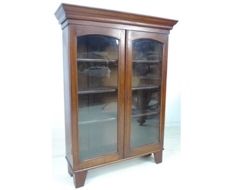 An Edwardian mahogany display cabinet, cornice over two glazed doors, three adjustable shelves, raised on bracket feet, 94.5 