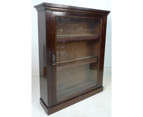 An early / mid 20th century mahogany display cabinet, with single glazed door enclosing two fixed shelves with leather edging