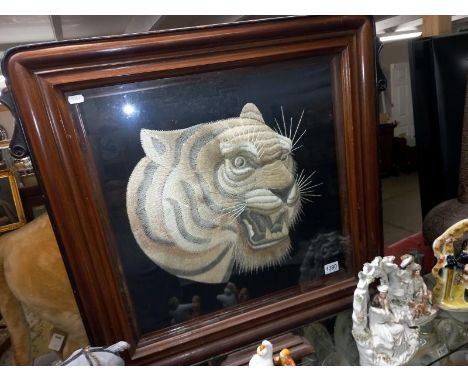 A mahogany embroidered tiger head fire screen, COLLECT ONLY.
