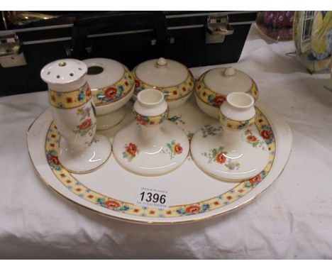 A pretty ceramic dressing table set.