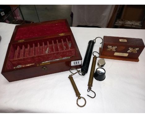 A vintage tray test kit in a wooden box, 4 bottles and a mahogany box balance scales etc