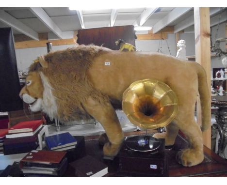 A full size Steiff Lion with button in ear and original tags. COLLECT ONLY.Length 160cm, height 98cm, width 45cm approx.